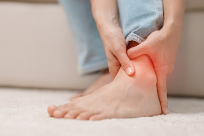 Woman struggling with ankle discomfort